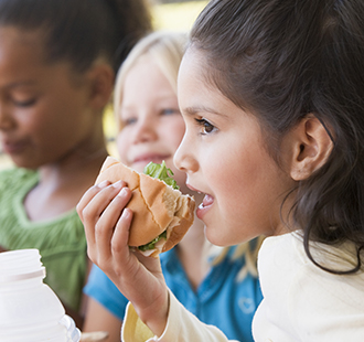 Female student eating a sandwich